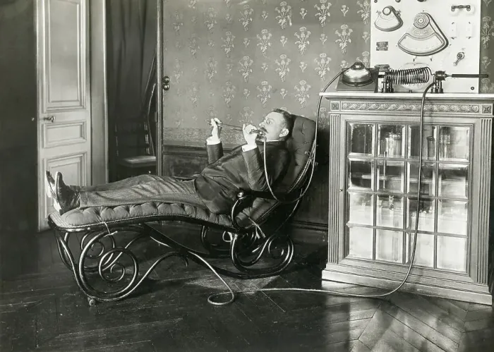 Framed Print : Reclining Man Holding Condenser Rod Framed Print : Reclining Man Holding Condenser Rod