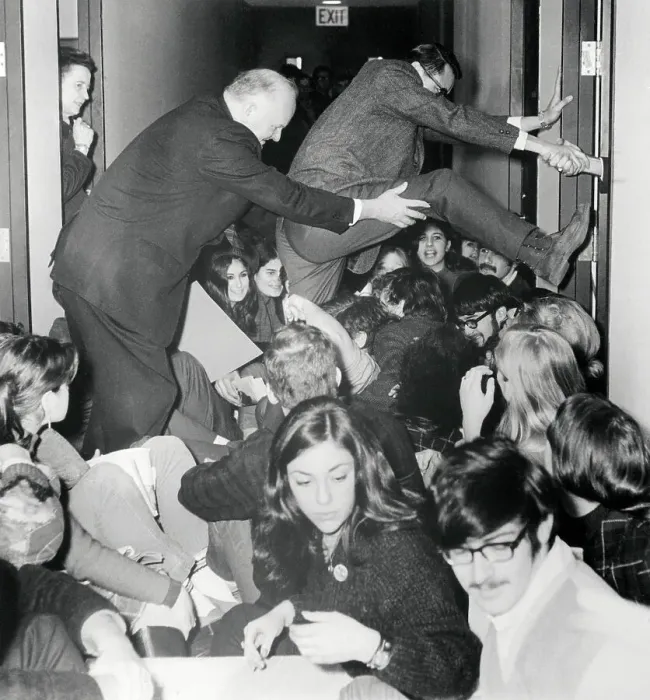 Framed Print : Recruiters Attempting to Climb over Protesters Framed Print : Recruiters Attempting to Climb over Protesters