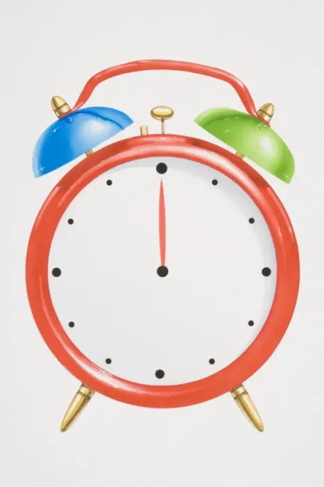 Framed Print : Red alarm clock with green and blue bells on top Framed Print : Red alarm clock with green and blue bells on top