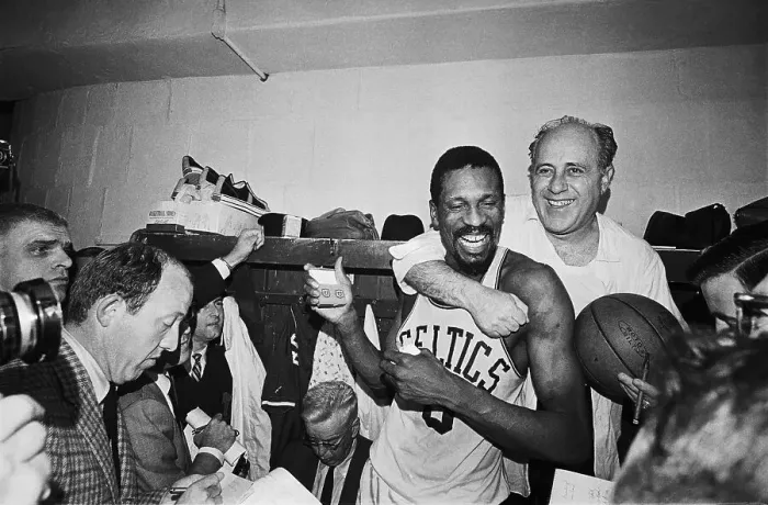 Framed Print : Red Auerbach Hugging Bill Russell at Press Conference