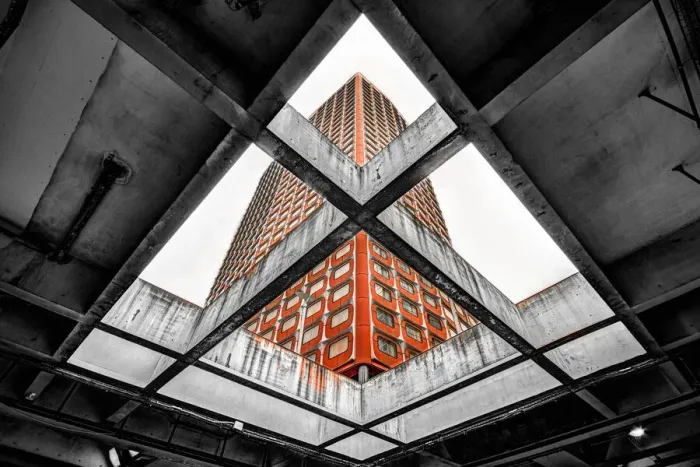 Framed Print : A red building seen through a concrete slab Framed Print : A red building seen through a concrete slab