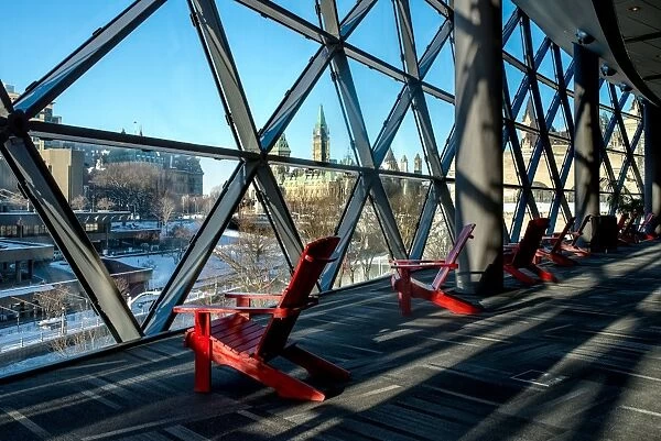Red chairs overlooking downtown Ottawa