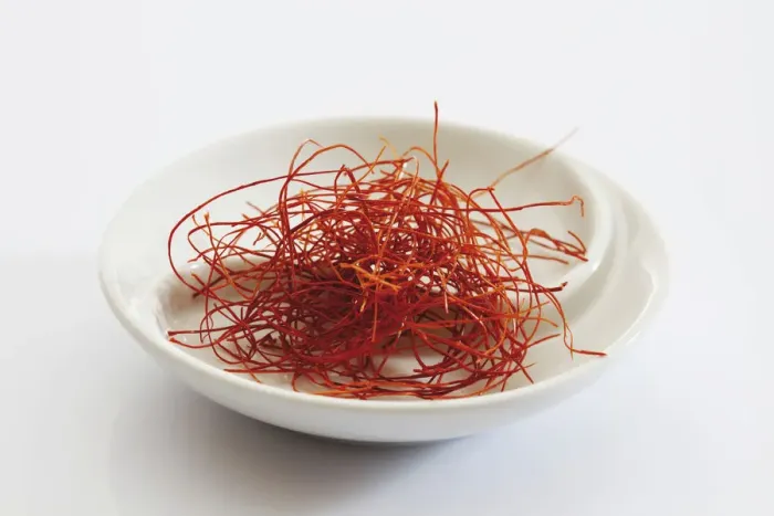 Framed Print : Red chilli threads in a small porcelain bowl Framed Print : Red chilli threads in a small porcelain bowl