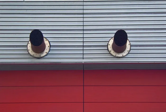 Framed Print : Red Clone. A color photo of two ventilation pipes jutting out Framed Print : Red Clone. A color photo of two ventilation pipes jutting out