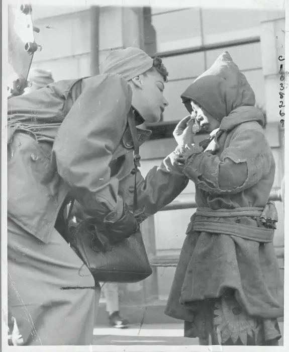 Framed Print : Red Cross Worker Wiping Boy's Tears Framed Print : Red Cross Worker Wiping Boy's Tears