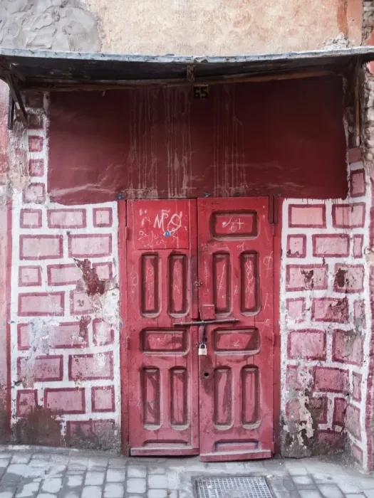 Framed Print : Red door in faux brick wall, Marrakech, Morocco