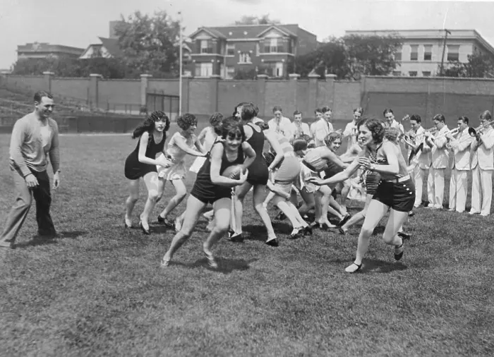Framed Print : Red Grange Coaching a Girls Football team