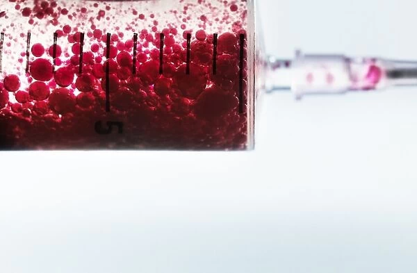 Red liquid inside syringe