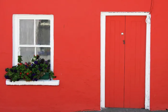 Framed Print : A Red Painted House With Flower Box In The Window Framed Print : A Red Painted House With Flower Box In The Window
