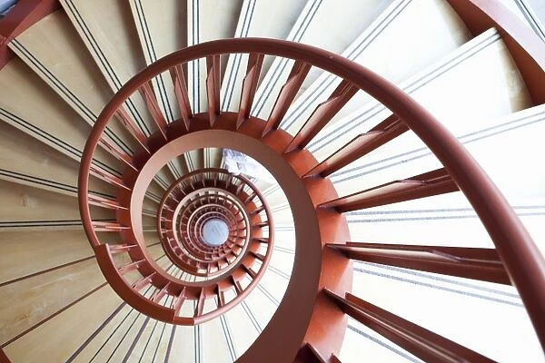 A red spiral staircase in a laboratory