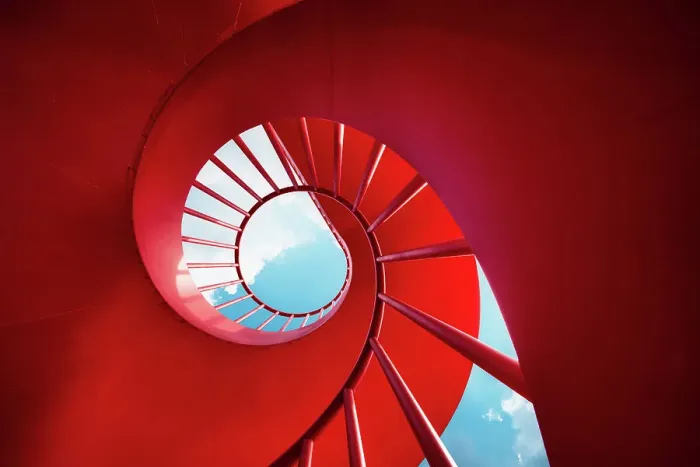 Framed Print : Red spiral staircase against sky Framed Print : Red spiral staircase against sky