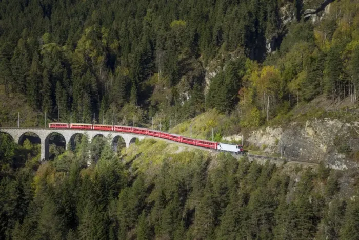 Framed Print : Red train in the mountains