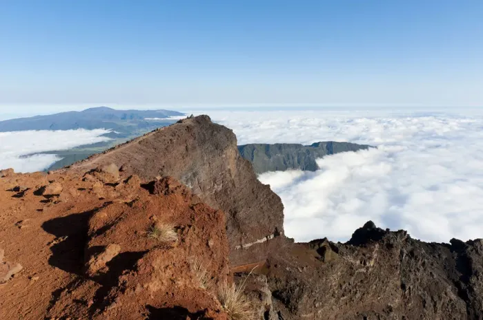 Framed Print : Red volcanic rock on the summit, Piton des Neiges Mountain, 3069 m, above the clouds, near Cilaos, French Overseas Territory, La Reunion