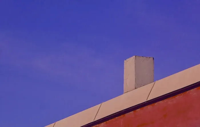 Framed Print : Red Wall. A color photo of a red commercial building in southeast Portland