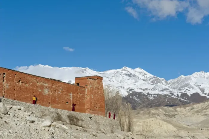 Framed Print : Red wall of a building with monks, Choede Gompa monastery, snow-capped mountains of Mustang Himal mountain range at back, Lo Manthang, Upper Mustang, Lo, Nepal Framed Print : Red wall of a building with monks, Choede Gompa monastery, snow-capped mountains of Mustang Himal mountain range at back, Lo Manthang, Upper Mustang, Lo, Nepal