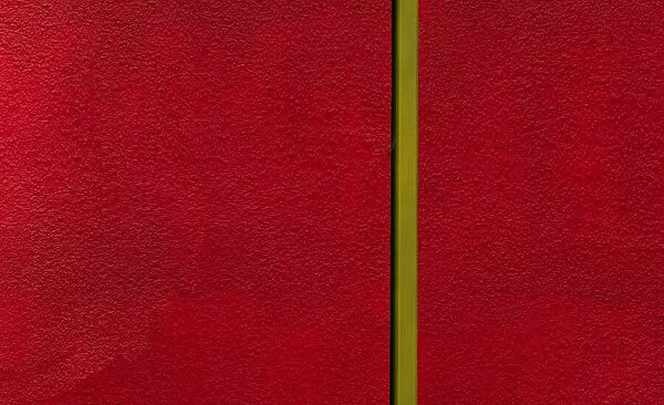 Red Wall With Yellow Pipe