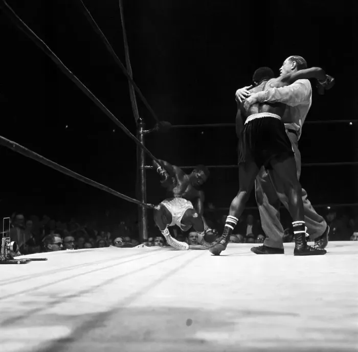 Framed Print : Referee Holds Boxer Back, Other Sags On Ropes Framed Print : Referee Holds Boxer Back, Other Sags On Ropes