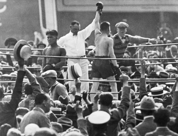 Framed Print : Referee Holds Boxer'S Hand In Victory Framed Print : Referee Holds Boxer'S Hand In Victory