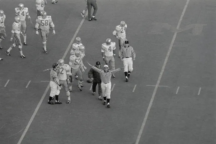 Framed Print : Referee Making Call During Football Game