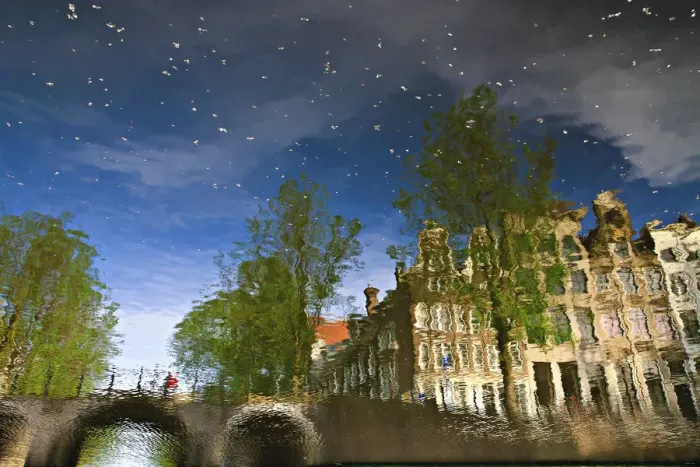 Framed Print : Reflection of buildings in a canal in Amsterdam, Holland, Netherlands, Europe Framed Print : Reflection of buildings in a canal in Amsterdam, Holland, Netherlands, Europe