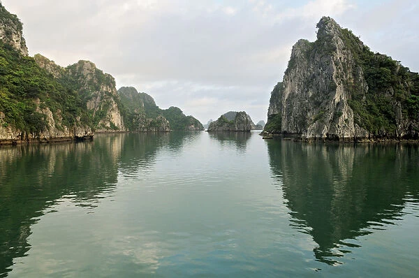 Reflection of karst islands in Bai Tu Long Bay