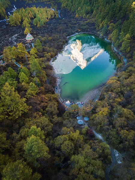 The reflection of snowy mountain on Zhuomala lake in Yading Nature Reserve, Sichuan