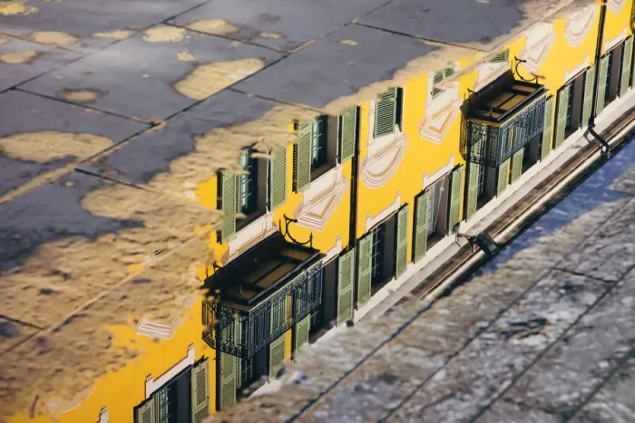 Framed Print : Reflection of a yellow building in a puddle, Nice, France Framed Print : Reflection of a yellow building in a puddle, Nice, France