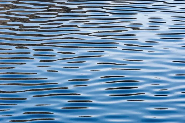 Framed Print : Reflections on a calm sea surface, Faroe Islands, Denmark
