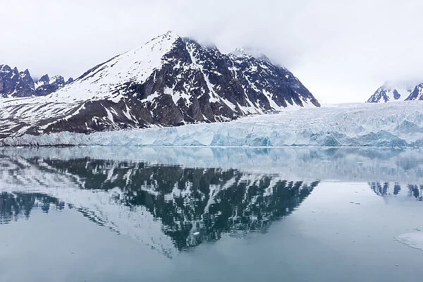 Reflections of mountains and Monaco glacier, Spitsbergen, Svalbard, Norway
