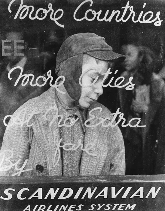 Framed Print : Refugee. An Egyptian Jewish refugee standing behind a sign advertising Framed Print : Refugee. An Egyptian Jewish refugee standing behind a sign advertising