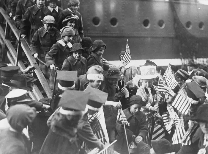 Framed Print : Refugee Children Waving American Flags