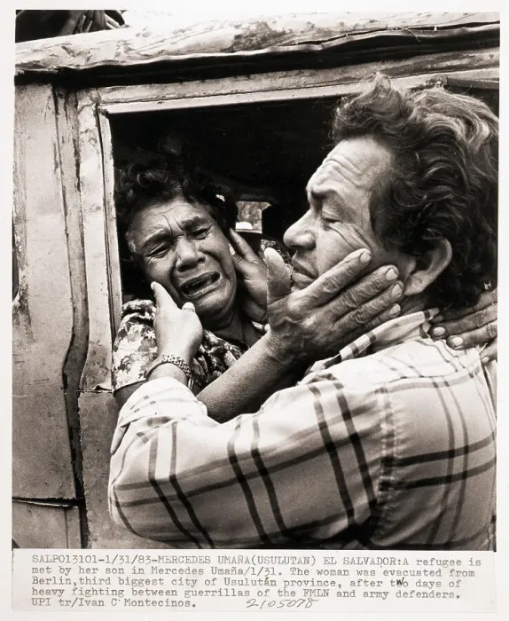 Framed Print : Refugee Woman Embracing Her Son Framed Print : Refugee Woman Embracing Her Son