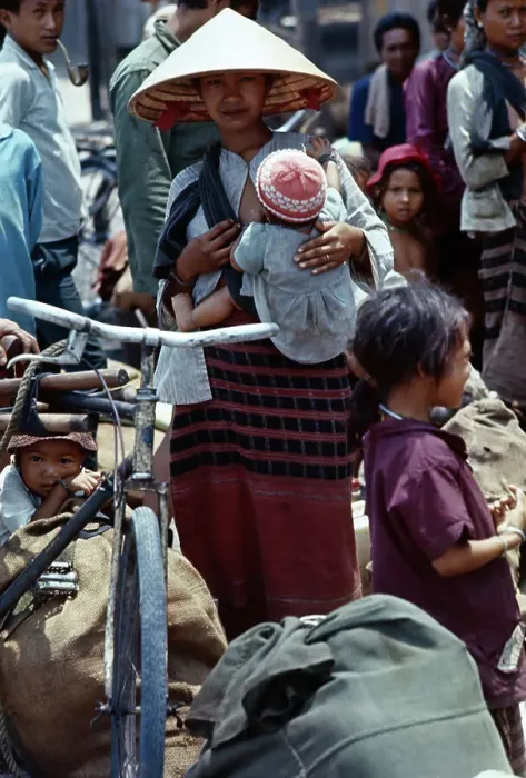 Framed Print : Refugee Woman Holding Her Child Framed Print : Refugee Woman Holding Her Child