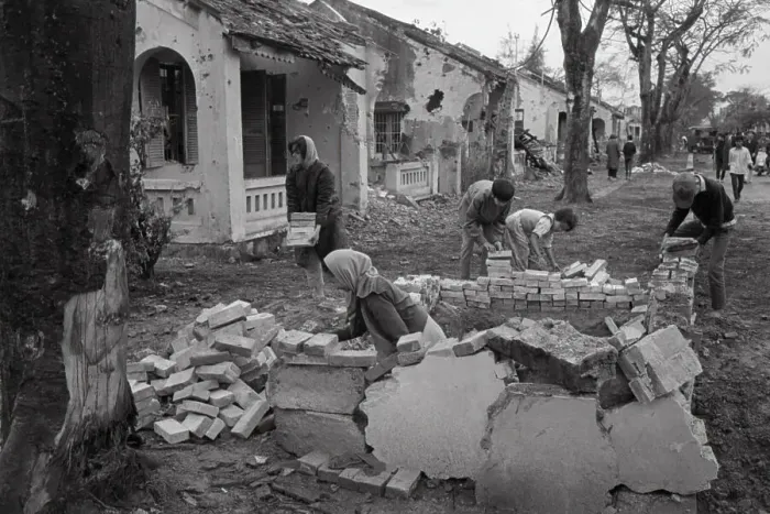 Framed Print : Refugees Building a Shelter after Attacks Framed Print : Refugees Building a Shelter after Attacks