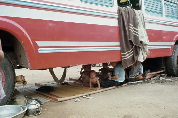 Framed Print : Refugees Sheltering Under Truck Framed Print : Refugees Sheltering Under Truck