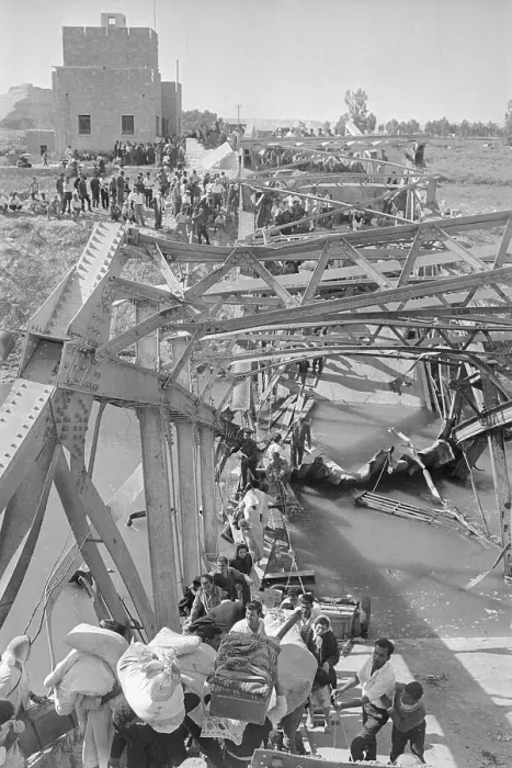 Framed Print : Refugees Walk Across Damaged Bridge Framed Print : Refugees Walk Across Damaged Bridge