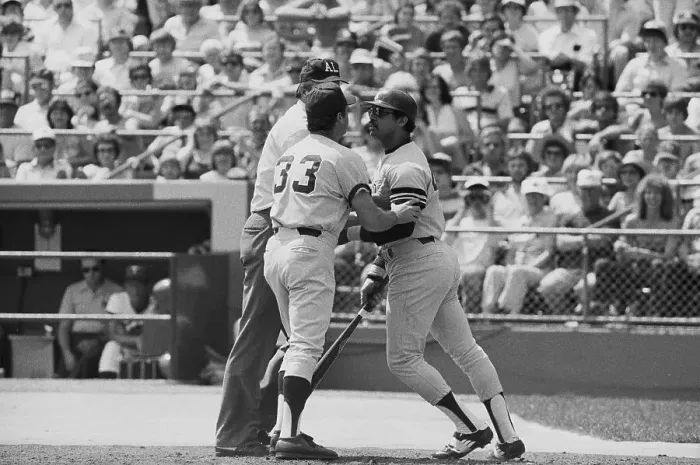 Framed Print : Reggie Jackson Being Restrained During Game Framed Print : Reggie Jackson Being Restrained During Game