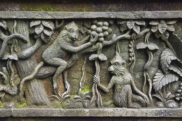 Relief with macaques at Monkey Forest temple, Pura Dalem Agung Padangtegal temple in the Ubud Monkey Forest, Ubud, Bali, Indonesia