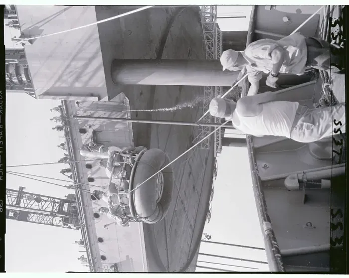 Framed Print : Reporters and Construction Workers Being Winched to Ship