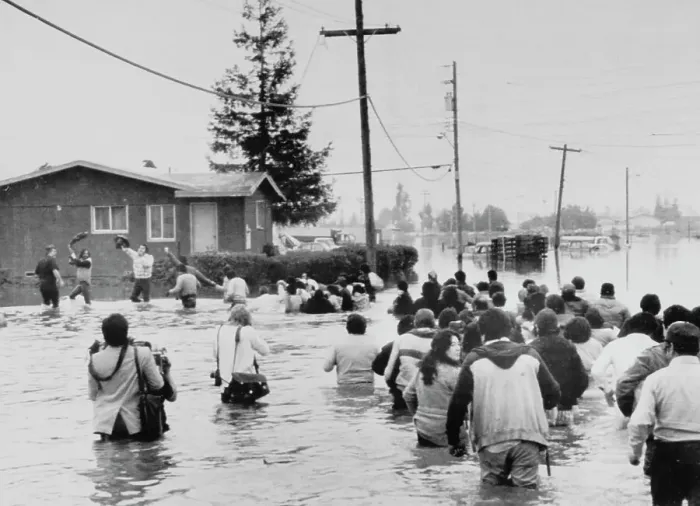 Framed Print : Residents Wade to Flooded Homes Framed Print : Residents Wade to Flooded Homes