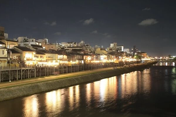 Restaurants by night along Kamogawa river in Kyoto