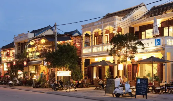 Framed Print : retaurants illuminated at dusk
