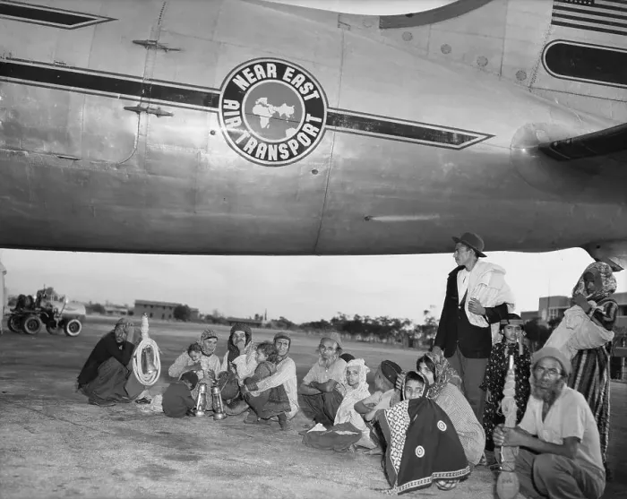 Framed Print : Returning Exiles Sitting by Plane Framed Print : Returning Exiles Sitting by Plane