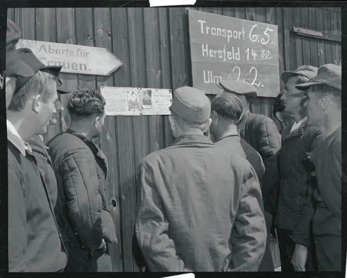 Framed Print : Returning POWs Viewing Photos of Comrades Framed Print : Returning POWs Viewing Photos of Comrades
