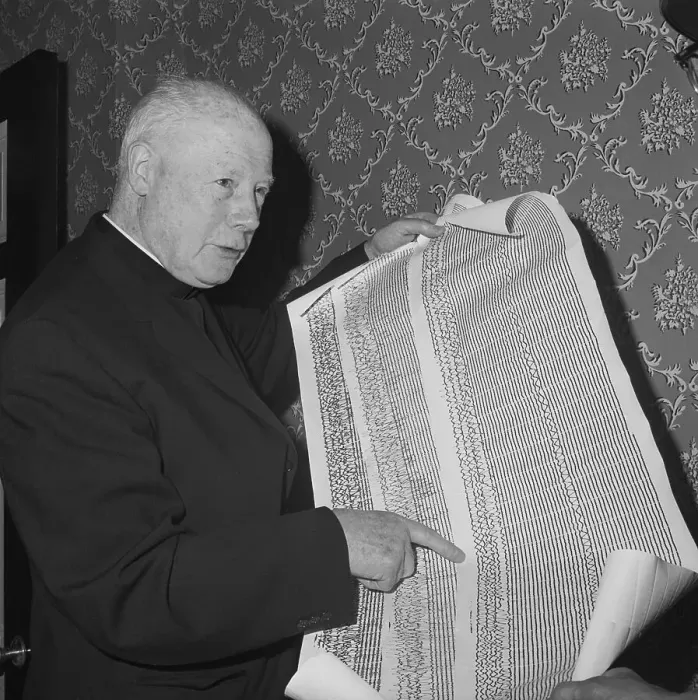 Framed Print : Reverend Holding Seismograph Recordings Framed Print : Reverend Holding Seismograph Recordings