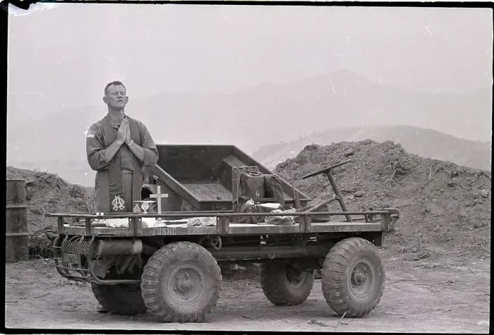 Framed Print : Rev.Kneels In Prayer On Military Vehicle Framed Print : Rev.Kneels In Prayer On Military Vehicle
