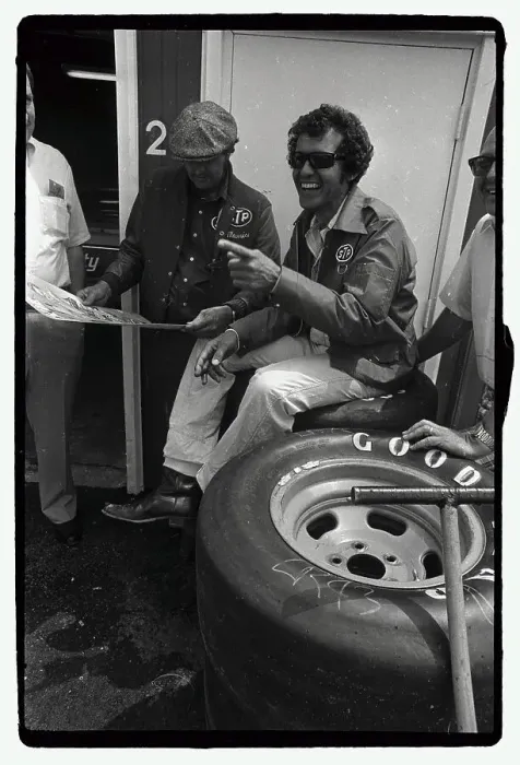 Framed Print : Richard Petty Seated on Tires and Laughing Framed Print : Richard Petty Seated on Tires and Laughing