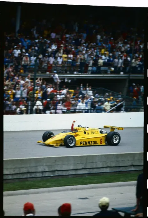 Framed Print : Rick Mears Driving and Raising Fist Framed Print : Rick Mears Driving and Raising Fist