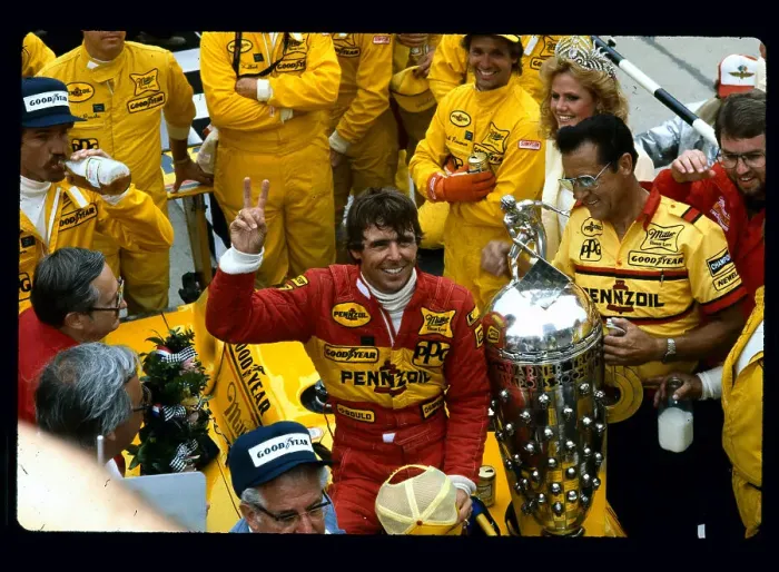 Framed Print : Rick Mears in Winners Circle Giving Victory Sign Framed Print : Rick Mears in Winners Circle Giving Victory Sign