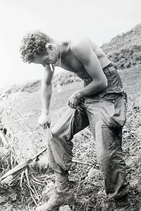 Framed Print : Rifleman Scraping Mud From His Trousers Framed Print : Rifleman Scraping Mud From His Trousers